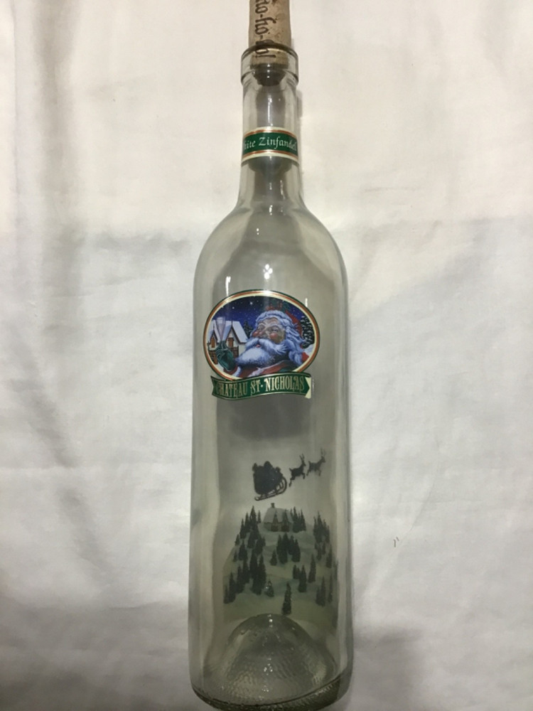 Christmas themed empty Chateau St. Nicholas wine bottle