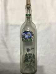Christmas themed empty Chateau St. Nicholas wine bottle