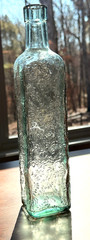 Vintage Tall Bottle. Antique green intricate bottle CANADA