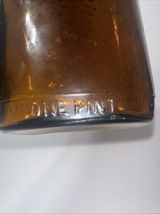 Vintage 1930&rsquo;s Brown Embossed Grape & Leaf & Vine One Pint Wine Bottle Wine Oval