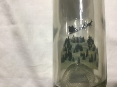 Christmas themed empty Chateau St. Nicholas wine bottle
