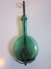 Vintage Green blown Glass 9.5&Prime; WINE Bottle W/13&Prime; WROUGHT IRON LEAF DESIGN