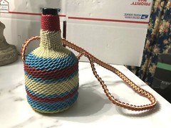 Vintage Plastic Wicker Wrapped Wine Bottle Decanter w/long strap for hanging