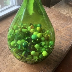 Green Glass Wine Bottle with Cap, Filled with Assorted vintage Marbles Inside