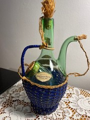 1963 Chianti Italian Wine Green Glass Decanter & Blue Wicker Basket w/labels.