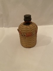Small Antique Wicker Wrapped Brown Glass Bottle