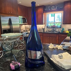 Empty Colbalt blue Incanto Wine bottle