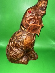 VINTAGE LEATHER WRAPPED ELEPHANT WINE BOTTLE WITH RED EYES AND GOLD CHAIN