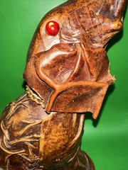 VINTAGE LEATHER WRAPPED ELEPHANT WINE BOTTLE WITH RED EYES AND GOLD CHAIN