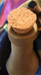 Vintage Frosted Glass wine bottle with embossed grapes design with cork