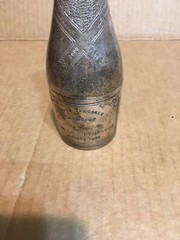 Used. Approx 7” Silver Plated by Parks Cuvée Speciale Premier Champagne Bottle