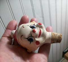 Vintage 1950&rsquo;s clown wine bottle decanter clear glass body ceramic top feet