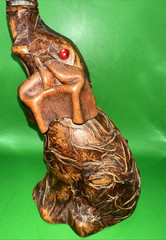 VINTAGE LEATHER WRAPPED ELEPHANT WINE BOTTLE WITH RED EYES AND GOLD CHAIN
