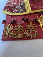 VINTAGE 1960s WINE BOTTLE COVER W/WINE GLASS CHARMS