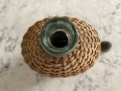 Vintage Coracle Green Glass Wicker Wrapped Bottle ( 9 inches tall )