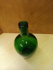 This green glass demijohn bottle