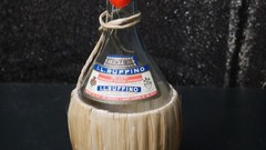I.L. RUFFINO 1970 VTG WINE BOTTLE EMPTY WITH RATTAN WRAP AND CORK CAP