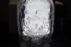 Vintage Garrett&rsquo;s American Wines embossed clear 1 quart wine bottle grapes