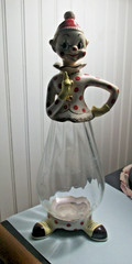 Vintage 1950&rsquo;s clown wine bottle decanter clear glass body ceramic top feet