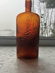Jordan Amber Wine Bottle with Embossed Grapes Motif Vintage 1920’s