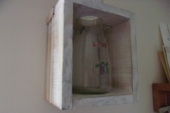 LOVE WINE BOTTLE IN ANTIQUE WHITE BOX. 8 BY 5 BY 4 INCHES.