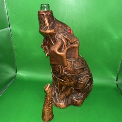 VINTAGE LEATHER WRAPPED ELEPHANT WINE BOTTLE WITH RED EYES AND GOLD CHAIN