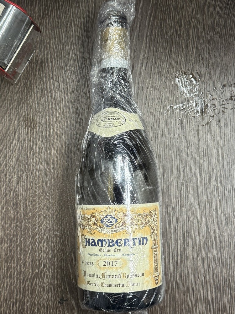 Grand CRU CHambertin 2017 and 2004empty wine bottles with cork