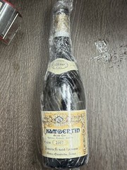 Grand CRU CHambertin 2017 and 2004empty wine bottles with cork