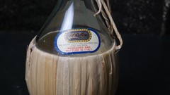 I.L. RUFFINO 1970 VTG WINE BOTTLE EMPTY WITH RATTAN WRAP AND CORK CAP