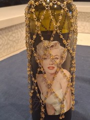 Marilyn Monroe Merlot wine bottle, adorned with beaded bottle cover.
