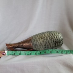 Empty wine bottle in the style of ancient Greece with a basket weave texture and