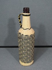 Vintage 70s Plastic Tube Weave Black & White Glass Bottle