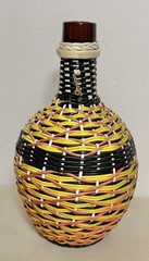 V Levante- Viresa Wine Bottle With Woven Scoubidou Wicker 11” Tall